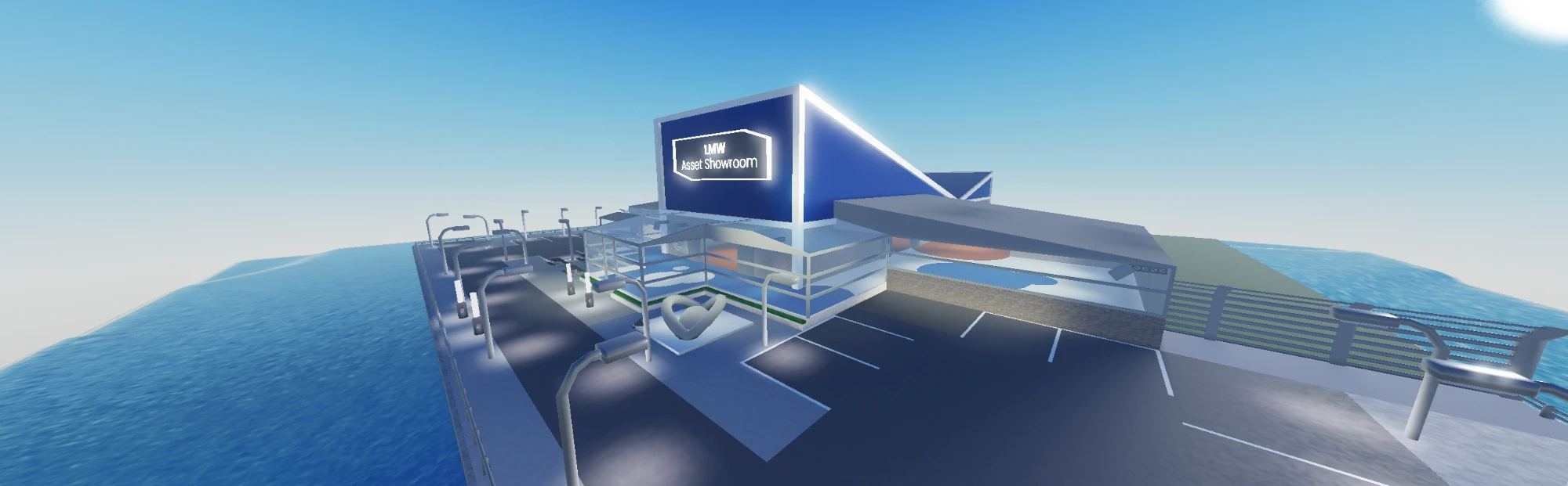 Angled view of the showroom's frontage, with the glowing LMW Asset Showroom sign, the glazed entrance and the forecourt.